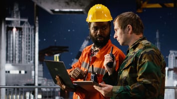 Soldier in uniform with an RF engineer