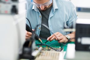RF engineer working on a PCB